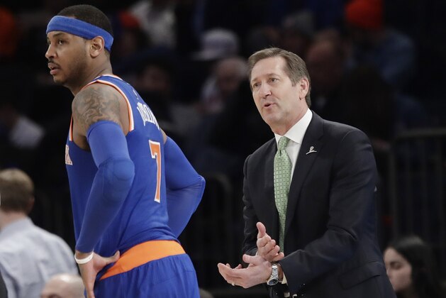 New York Knicks coach Jeff Hornacek, right, talks to Carmelo Anthony during the second half of the team's NBA basketball game against the Brooklyn Nets on Thursday, March 16, 2017, in New York. The Nets won 121-110. (AP Photo/Frank Franklin II)