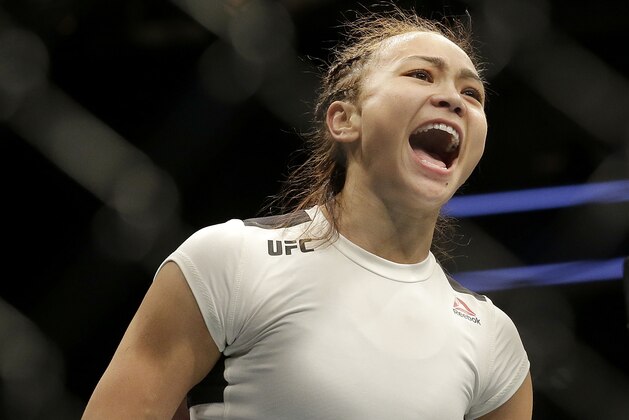 Michelle Waterson yells after beating Paige VanZant in a UFC Fight Night mixed martial arts fight in Sacramento, Calif., Saturday, Dec. 17, 2016. Waterson won by submission in the first round. (AP Photo/Jeff Chiu)