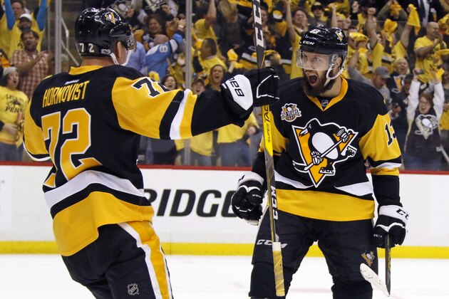 Pittsburgh Penguins' Nick Bonino (13) celebrates his goal with Patric Hornqvist (72) during the second period in Game one of a first-round NHL hockey playoff series against the Columbus Blue Jackets in Pittsburgh, Wednesday, April 12, 2017. (AP Photo/Gene J. Puskar)
