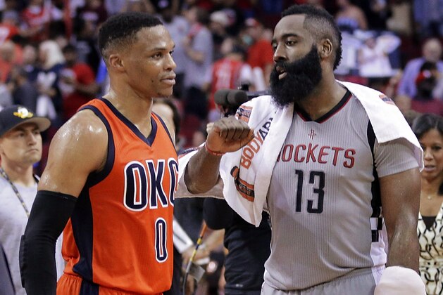 Oklahoma City Thunder's Russell Westbrook (0) and Houston Rockets' James Harden (13) talk on the court after an NBA basketball game in Houston, Sunday, March 26, 2017. (AP Photo/Michael Wyke)