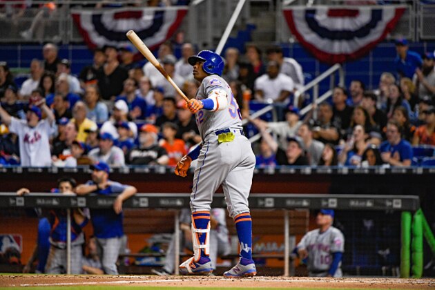 MIAMI, FL - APRIL 13:  Yoenis Cespedes #52 of the New York Mets hits a home run in the third inning against the Miami Marlins at Marlins Park on April 13, 2017 in Miami, Florida. (Photo by Mark Brown/Getty Images)