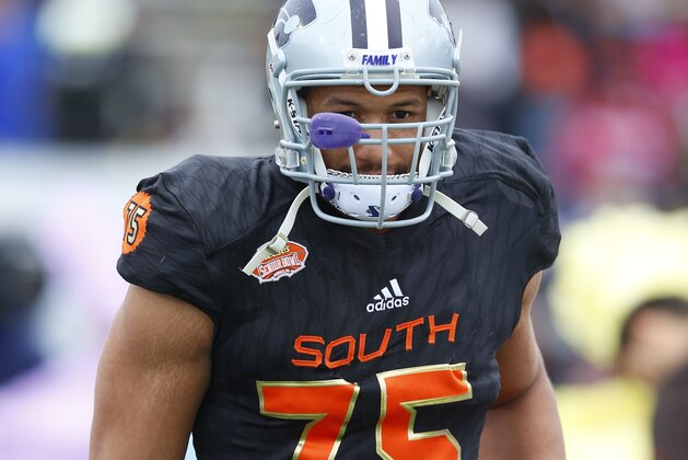 South squad defensive end Jordan Willis of Kansas State (75) runs on the field during the player introductions of the Senior Bowl NCAA college football game, Saturday, Jan. 28, 2017, at Ladd-Peebles Stadium in Mobile, Ala. (AP Photo/Butch Dill)