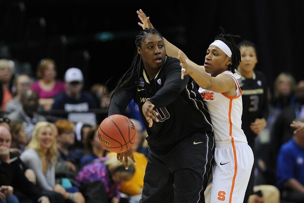Apr 3, 2016; Indianapolis, IN, USA; Washington Huskies forward/center Chantel Osahor (0) passes the ball as Syracuse Orange guard Cornelia Fondren (11) defends during the second quarter at Bankers Life Fieldhouse. Mandatory Credit: Thomas J. Russo-USA TODAY Sports