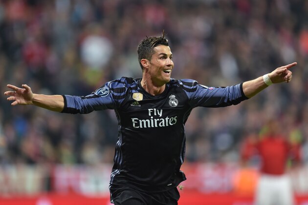 Real Madrid's Portuguese forward Cristiano Ronaldo celebrates after scoring during the UEFA Champions League 1st leg quarter-final football match FC Bayern Munich v Real Madrid in Munich, southen Germany on April 12, 2017. 
Security was ratcheted up in Munich, one day after three explosions rocked the team bus of German football club Borussia Dortmund minutes after the bus set off to a planned Champions League game against Monaco on Tuesday night (April 11, 2017). / AFP PHOTO / Christof STACHE        (Photo credit should read CHRISTOF STACHE/AFP/Getty Images)