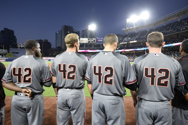 SAN DIEGO, CALIFORNIA - APRIL 15:  Arizona Diamondbacks players line up for the national anthem before a baseball game against the San Diego Padres at PETCO Park on April 15, 2016 in San Diego, California.  All players are wearing #42 in honor of Jackie Robinson Day.(Photo by Denis Poroy/Getty Images)