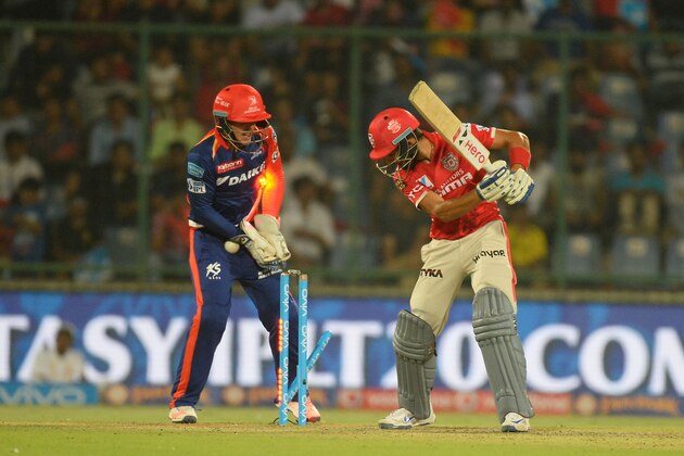 Kings XI Punjab batsman Manan Vohara(R)looks towards his shattered wicket after he is bowled as Kings XI Punjab wicketkeeper Quinton De Kock looks on during the 2016 Indian Premier League (IPL) Twenty20 cricket match between Delhi Daredevils and Kings XI Punjab at The Feroz Shah Kotla Cricket Stadium in New Delhi on April 15, 2016. ------IMAGE RESTRICTED TO EDITORIAL USE - STRICTLY NO COMMERCIAL USE- / AFP / SAJJAD HUSSAIN        (Photo credit should read SAJJAD HUSSAIN/AFP/Getty Images)