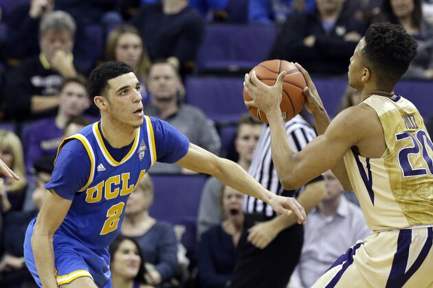 UCLA's Lonzo Ball (2) defends Washington's Markelle Fultz in an NCAA college basketball game Saturday, Feb. 4, 2017, in Seattle. UCLA won 107-66. (AP Photo/Elaine Thompson)