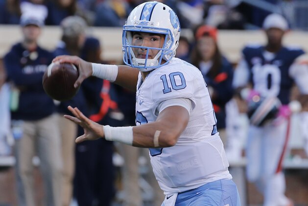 North Carolina quarterback Mitch Trubisky (10) tosses a pass during the second half of an NCAA college football game at Scott stadium in Charlottesville, Va., Saturday, Oct. 22, 2016. UNC won the game 35-14. (AP Photo/Steve Helber)