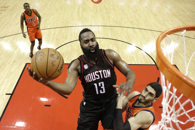 Houston Rockets' James Harden (13) goes up for a shot as Oklahoma City Thunder's Enes Kanter defends during the first half in Game 1 of an NBA basketball first-round playoff series, Sunday, April 16, 2017, in Houston. (AP Photo/David J. Phillip)