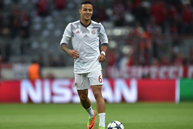 ayern Munich's Spanish midfielder Thiago Alcantara warms up prior the UEFA Champions League 1st leg quarter-final football match FC Bayern Munich v Real Madrid in Munich, southen Germany on April 12, 2017. 
Security was ratcheted up in Munich, one day after three explosions rocked the team bus of German football club Borussia Dortmund minutes after the bus set off to a planned Champions League game against Monaco on Tuesday night (April 11, 2017). / AFP PHOTO / Christof STACHE        (Photo credit should read CHRISTOF STACHE/AFP/Getty Images)