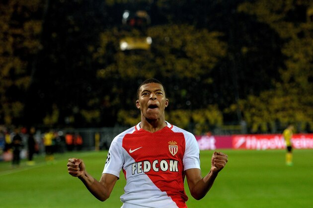 TOPSHOT - Monaco's French forward Kylian Mbappe Lottin celebrate scoring during the UEFA Champions League 1st leg quarter-final football match BVB Borussia Dortmund v Monaco in Dortmund, western Germany on April 12, 2017.
The match had been postponed after three explosions hit German football team Borussia Dortmund's bus late on April 11, 2017 ahead of a Champions League home game. / AFP PHOTO / Sascha Schuermann        (Photo credit should read SASCHA SCHUERMANN/AFP/Getty Images)
