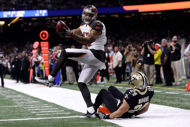 NEW ORLEANS, LA - DECEMBER 24:  Mike Evans #13 of the Tampa Bay Buccaneers makes a catch over  Sterling Moore #24 of the New Orleans Saints at the Mercedes-Benz Superdome on December 24, 2016 in New Orleans, Louisiana.  (Photo by Sean Gardner/Getty Images)
