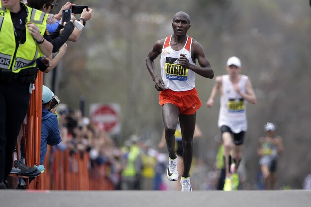 Geoffrey Kirui, of Kenya, leads Galen Rupp, of the United States, and the rest of the field along the course of the 121st Boston Marathon on Monday, April 17, 2017, in Brookline, Mass. (AP Photo/Steven Senne)