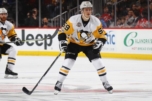 NEWARK, NJ - APRIL 06:  Jake Guentzel #59 of the Pittsburgh Penguins skates against the New Jersey Devils at the Prudential Center on April 6, 2017 in Newark, New Jersey. The Penguins defeated the Devils 7-4.  (Photo by Bruce Bennett/Getty Images)