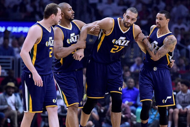 LOS ANGELES, CA - APRIL 15:  Rudy Gobert #27 of the Utah Jazz is helped off the court by Joe Ingles #2, Boris Diaw #33 and George Hill #3 after an injury during the first half against the LA Clippers at Staples Center on April 15, 2017 in Los Angeles, California.  NOTE TO USER: User expressly acknowledges and agrees that, by downloading and or using this photograph, User is consenting to the terms and conditions of the Getty Images License Agreement.  (Photo by Harry How/Getty Images)