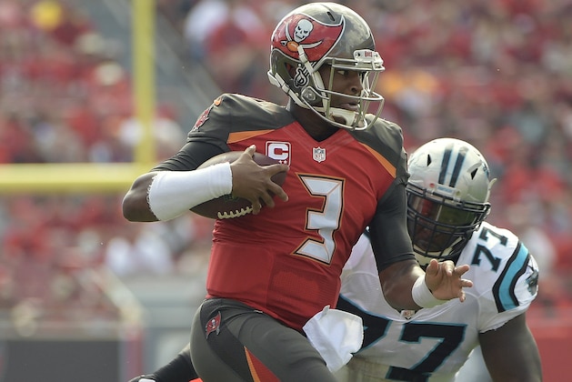 Tampa Bay Buccaneers quarterback Jameis Winston (3) eludes Carolina Panthers defensive tackle Kyle Love (77) on a run during the first quarter of an NFL football game Sunday, Jan. 1, 2017, in Tampa, Fla. (AP Photo/Phelan Ebenhack)