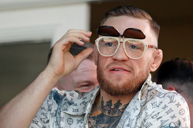LIVERPOOL, UNITED KINGDOM - APRIL 08: (EMBARGOED FOR PUBLICATION IN UK NEWSPAPERS UNTIL 48 HOURS AFTER CREATE DATE AND TIME) Conor McGregor, current UFC Lightweight Champion,  watches the racing as he attends day 3 'Grand National Day' of the Randox Health Grand National Festival at Aintree Racecourse on April 8, 2017 in Liverpool, England. (Photo by Max Mumby/Indigo/Getty Images)