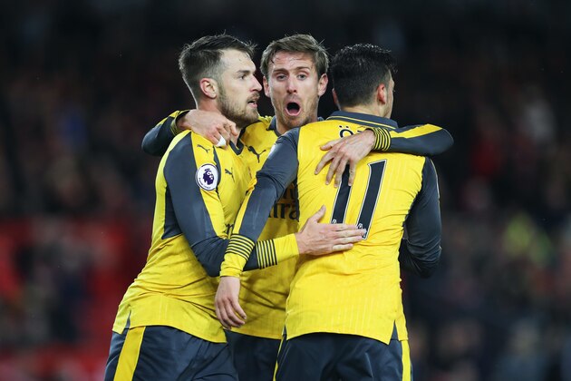 MIDDLESBROUGH, ENGLAND - APRIL 17:  Mesut Ozil of Arsenal (11) celebrates as he scores their second goal with Aaron Ramsey (L) and Nacho Monreal (C)  during the Premier League match between Middlesbrough and Arsenal at Riverside Stadium on April 17, 2017 in Middlesbrough, England.  (Photo by Ian MacNicol/Getty Images)