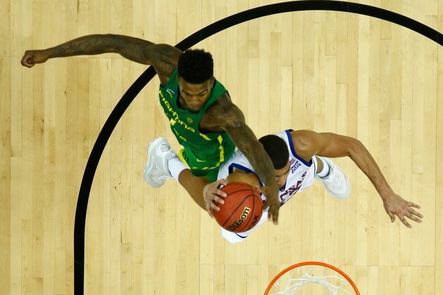 KANSAS CITY, MO - MARCH 25:  Landen Lucas #33 of the Kansas Jayhawks has his shot blocked by Jordan Bell #1 of the Oregon Ducks during the 2017 NCAA Men's Basketball Tournament Midwest Regional at Sprint Center on March 25, 2017 in Kansas City, Missouri.  (Photo by Jamie Squire/Getty Images)