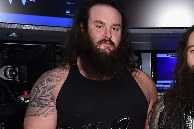 NEW YORK, NY - MARCH 29:  WWE Superstars Braun Strowman, Bray Wyatt and Erick Rowan ring The New York Stock Exchange Opening Bell in honor of WrestleMania 32  at New York Stock Exchange on March 29, 2016 in New York City.  (Photo by Jamie McCarthy/Getty Images)