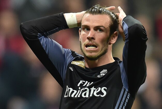 Real Madrid's Welsh forward Gareth Bale reacts after a chance during the UEFA Champions League 1st leg quarter-final football match FC Bayern Munich v Real Madrid in Munich, southen Germany on April 12, 2017. 
Security was ratcheted up in Munich, one day after three explosions rocked the team bus of German football club Borussia Dortmund minutes after the bus set off to a planned Champions League game against Monaco on Tuesday night (April 11, 2017). / AFP PHOTO / Christof STACHE        (Photo credit should read CHRISTOF STACHE/AFP/Getty Images)