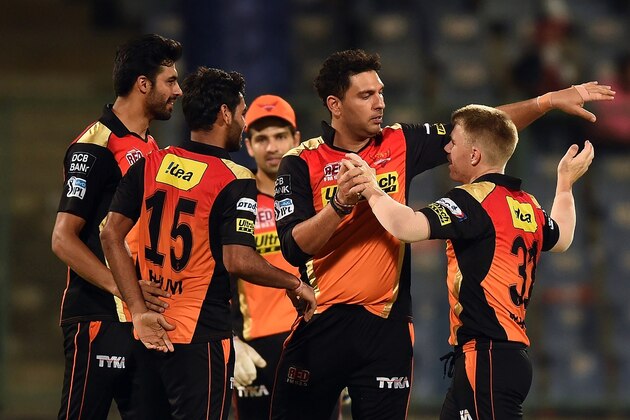 Sunrisers Hyderabad captain David Warner (R) celebrates the victory over Kolkata Knight Riders with teammates  during the 2016 Indian Premier League (IPL) Twenty20 eliminator cricket match between Kolkata Knight Riders and Sunrisers Hyderabad at the Feroz Shah Kotla Cricket Stadium in New Delhi on May 25, 2016. / AFP / PRAKASH SINGH        (Photo credit should read PRAKASH SINGH/AFP/Getty Images)