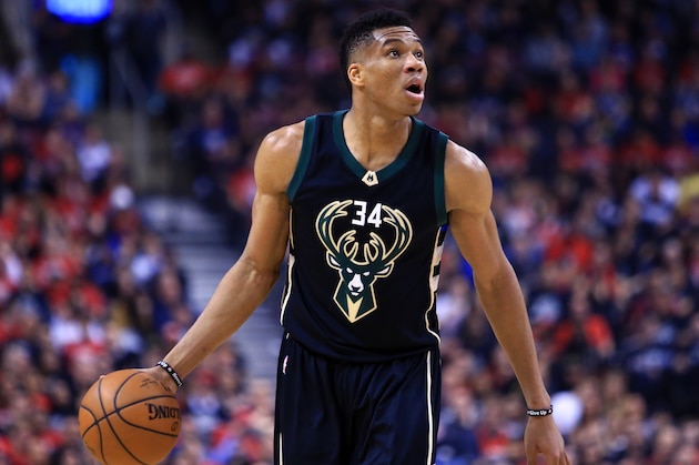 TORONTO, ON - APRIL 15:  Giannis Antetokounmpo #34 of the Milwaukee Bucks dribbles the ball in the first half of Game One of the Eastern Conference Quarterfinals against the Toronto Raptors during the 2017 NBA Playoffs at Air Canada Centre on April 15, 2017 in Toronto, Canada.  NOTE TO USER: User expressly acknowledges and agrees that, by downloading and or using this photograph, User is consenting to the terms and conditions of the Getty Images License Agreement.  (Photo by Vaughn Ridley/Getty Images)