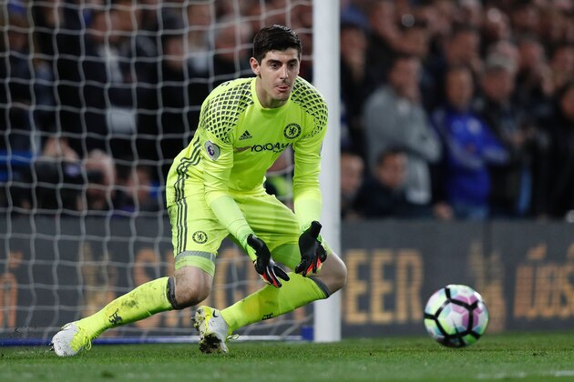 Chelsea's Belgian goalkeeper Thibaut Courtois makes a save during the English Premier League football match between Chelsea and Manchester City at Stamford Bridge in London on April 5, 2017. / AFP PHOTO / Adrian DENNIS / RESTRICTED TO EDITORIAL USE. No use with unauthorized audio, video, data, fixture lists, club/league logos or 'live' services. Online in-match use limited to 75 images, no video emulation. No use in betting, games or single club/league/player publications.  /         (Photo credit should read ADRIAN DENNIS/AFP/Getty Images)