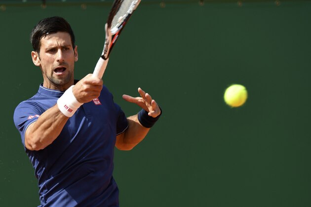 Serbia's Novak Djokovic hits a return to French's Gilles Simon during the Monte-Carlo ATP Masters Series tournament on April 18, 2017 in Monaco / AFP PHOTO / Yann COATSALIOU        (Photo credit should read YANN COATSALIOU/AFP/Getty Images)