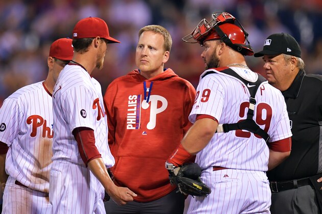 PHILADELPHIA, PA - APRIL 11: Starting pitcher Clay Buchholz #21 of the Philadelphia Phillies talks with team trainer Shawn Fcasni before leaving the game against the New York Mets at Citizens Bank Park on April 11, 2017 in Philadelphia, Pennsylvania. (Photo by Drew Hallowell/Getty Images)