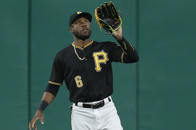 Pittsburgh Pirates center fielder Starling Marte catches a fly ball by Cincinnati Reds' Jose Peraza in the first inning of a baseball game, Tuesday, April 11, 2017, in Pittsburgh. (AP Photo/Keith Srakocic)