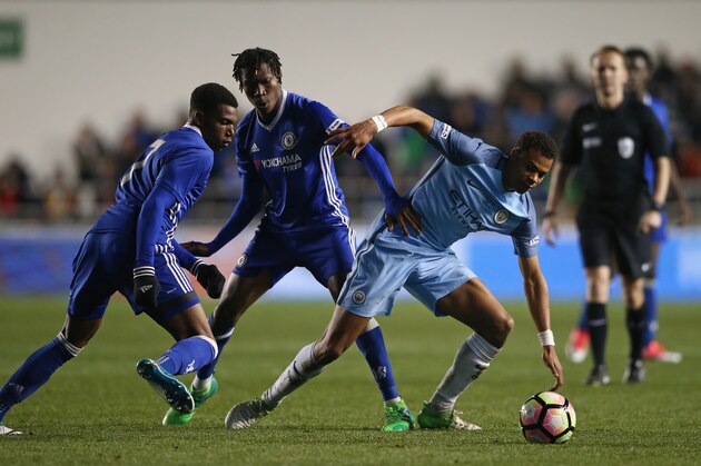 MANCHESTER, ENGLAND - APRIL 18: Lukas Nmecha of Manchester City and Tariq Uwakwe of Chelsea battle for possession during the FA Youth Cup Final First Leg match between Manchester City and Chelsea at The Academy Stadium on April 18, 2017 in Manchester, England.  (Photo by Jan Kruger/Getty Images)