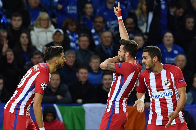 Atletico Madrid's Spanish midfielder Saul Niguez (C) celebrates scoring his team's first goal during the UEFA Champions League quarter-final second leg football match between Leicester City and Club Atletico de Madrid at the King Power stadium in Leicester on April 18, 2017. / AFP PHOTO / Ben STANSALL        (Photo credit should read BEN STANSALL/AFP/Getty Images)