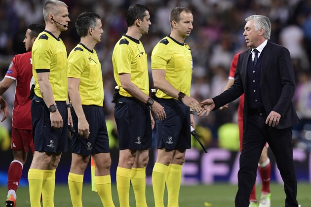 Bayern Munich's Italian head coach Carlo Ancelotti shakes hands with referees at the end of the UEFA Champions League quarter-final second leg football match Real Madrid vs FC Bayern Munich at the Santiago Bernabeu stadium in Madrid in Madrid on April 18, 2017. / AFP PHOTO / JAVIER SORIANO        (Photo credit should read JAVIER SORIANO/AFP/Getty Images)