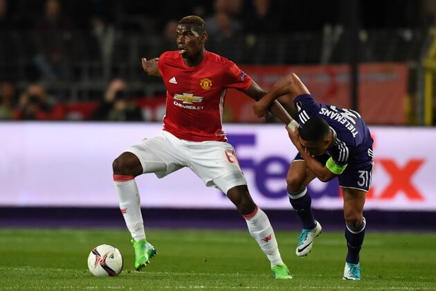 BRUSSELS, BELGIUM - APRIL 13: Paul Pogba of Manchester United and Youri Tielemans of Anderlecht compete for the ball during the UEFA Europa League quarter final first leg match between RSC Anderlecht and Manchester United at Constant Vanden Stock Stadium on April 13, 2017 in Brussels, Belgium. (Photo by Etsuo Hara/Getty Images)