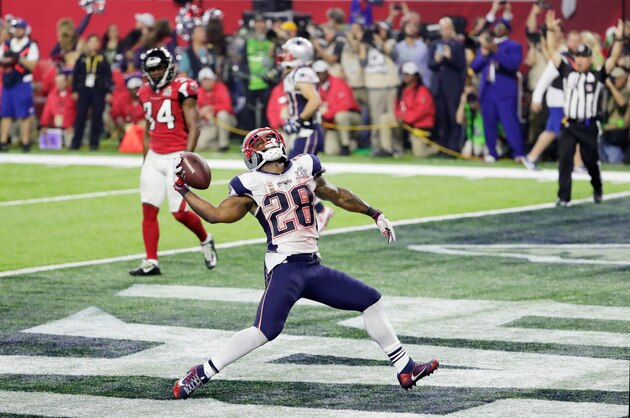 HOUSTON, TX - FEBRUARY 05:  James White #28 of the New England Patriots celebrates rushing for a 1-yard touchdown in the fourth quarter against the Atlanta Falcons during Super Bowl 51 at NRG Stadium on February 5, 2017 in Houston, Texas.  (Photo by Jamie Squire/Getty Images)