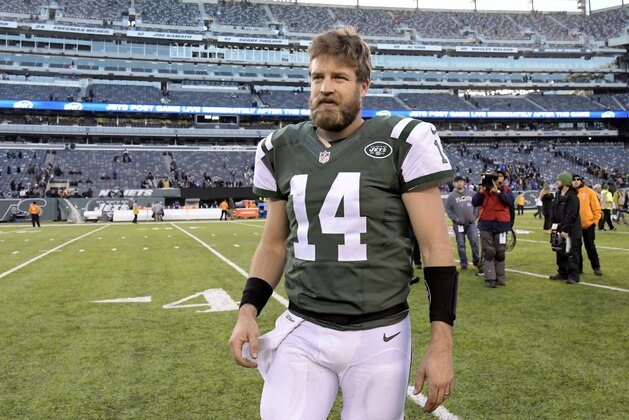 FILE - in this Jan. 1, 2017, file photo, New York Jets quarterback Ryan Fitzpatrick walks off the field after the team's NFL football game against the Buffalo Bills in East Rutherford, N.J. Fitzpatrick's contract with the Jets has voided, as expected, making the veteran quarterback a free agent. Fitzpatrick re-signed with the Jets last July on a one-year, $12 million deal. Technically, the contract was for two years, but contained language in which the second year would be automatically voided five days after the Super Bowl--meaning, Friday--if Fitzpatrick remained on the roster. (AP Photo/Bill Kostroun, File)