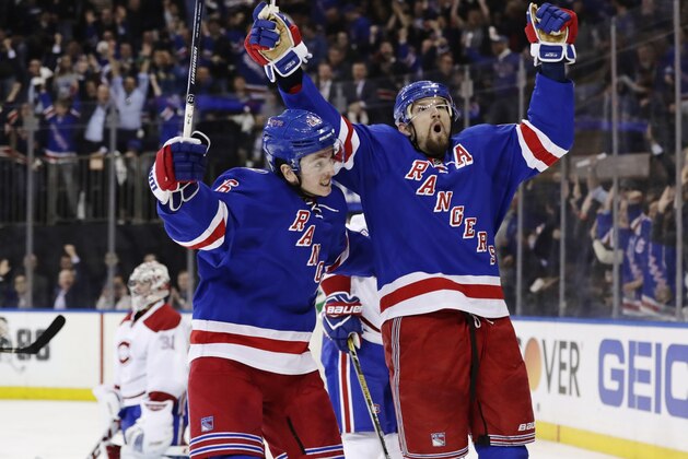 New York Rangers' Rick Nash, left, celebrates with teammate Jimmy Vesey, center, as Montreal Canadiens goalie Carey Price, left, reacts during the second period of an NHL hockey game in Game 4 of an NHL hockey first-round playoff series Tuesday, April 18, 2017, in New York. (AP Photo/Frank Franklin II)
