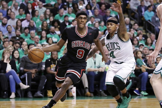 Chicago Bulls guard Rajon Rondo (9) drives towards the basket past Boston Celtics guard Isaiah Thomas (4) during the second quarter of a first-round NBA playoff basketball game in Boston, Tuesday, April 18, 2017. (AP Photo/Charles Krupa)