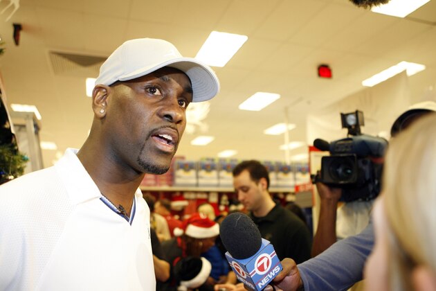 MIAMI - DECEMBER 17:  Gary Payton (L) of the Miami Heat answers questions from the media during Gary Payton's How the Glove Stole Christmas event at Target SuperStore December 17, 2006 in Miami, Florida.  NOTE TO USER: User expressly acknowledges and agrees that, by downloading and or using this Photograph, user is consenting to the terms and conditions of the Getty Images License Agreement.  Mandatory Copyright Notice: Copyright 2006 NBAE (Photo by Issac Baldizon/NBAE via Getty Images)
