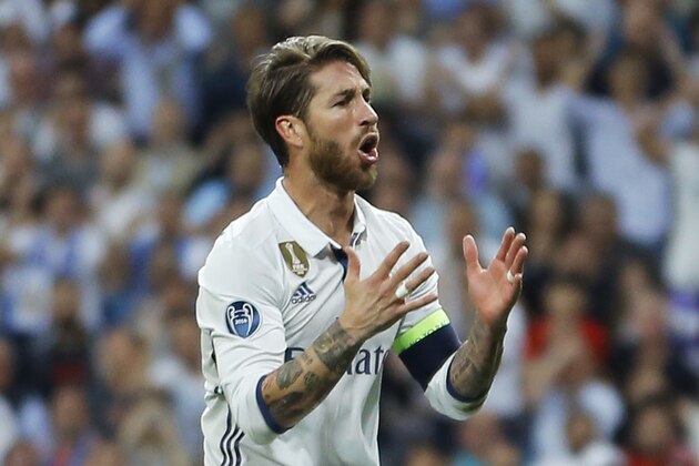 Real Madrid's Sergio Ramos reacts after missing a chance to score during the Champions League quarterfinal second leg soccer match between Real Madrid and Bayern Munich at Santiago Bernabeu stadium in Madrid, Spain, Tuesday April 18, 2017. (AP Photo/Francisco Seco)