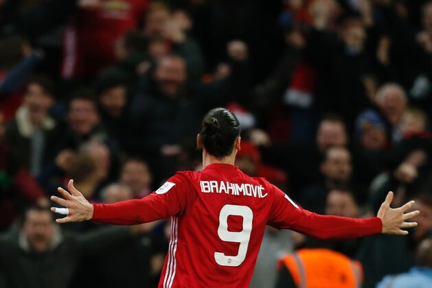 Manchester United's Swedish striker Zlatan Ibrahimovic celebrates after scoring their third goal during the English League Cup final football match between Manchester United and Southampton at Wembley stadium in north London on February 26, 2017.
Manchester United won the game 3-2. / AFP PHOTO / Ian KINGTON / RESTRICTED TO EDITORIAL USE. No use with unauthorized audio, video, data, fixture lists, club/league logos or 'live' services. Online in-match use limited to 75 images, no video emulation. No use in betting, games or single club/league/player publications.  /         (Photo credit should read IAN KINGTON/AFP/Getty Images)