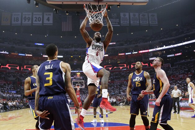 Los Angeles Clippers' DeAndre Jordan, center, dunks against the Utah Jazz during the first half in Game 2 of an NBA basketball first-round playoff series Tuesday, April 18, 2017, in Los Angeles. (AP Photo/Jae C. Hong)
