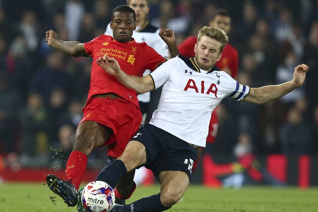 Tottenham Hotspur's Eric Dier, right, tackles Liverpool's Georginio Wijnaldum during the English League Cup soccer match between Liverpool and Tottenham Hotspur at Anfield in Liverpool, England, Tuesday, Oct. 25, 2016.(AP Photo/Dave Thompson)