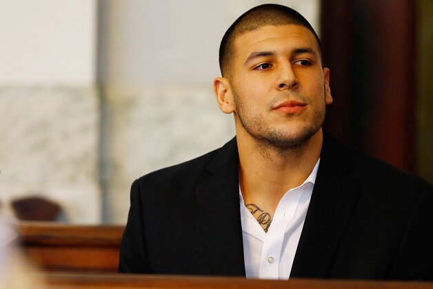 NORTH ATTLEBORO, MA - AUGUST 22: Aaron Hernandez sits in the courtroom of the Attleboro District Court during his hearing on August 22, 2013 in North Attleboro, Massachusetts. Former New England Patriot Aaron Hernandez has been indicted on a first-degree murder charge for the death of Odin Lloyd. (Photo by Jared Wickerham/Getty Images)