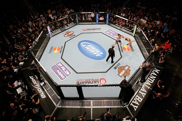 LAS VEGAS, NV - FEBRUARY 02:  An overhead view of the Octagon as Jose Aldo (R) jumps off the cage to throw a flying punch at Frankie Edgar during their featherweight title fight at UFC 156 on February 2, 2013 at the Mandalay Bay Events Center in Las Vegas, Nevada.  (Photo by Josh Hedges/Zuffa LLC/Zuffa LLC via Getty Images)