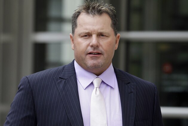 Former baseball player Roger Clemens leaves federal court in New York, Tuesday, April 29, 2014. The former Yankees pitcher wants a judge to stay an order that he share documents with his accuser in a defamation case. (AP Photo/Seth Wenig)