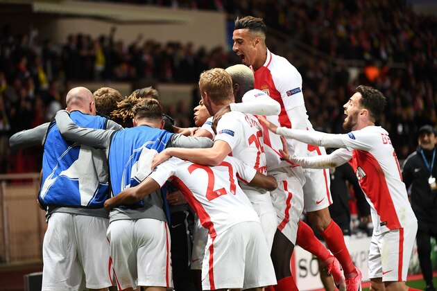 Monaco's Moroccan midfielder Nabil Dirar (Top) and Monaco's Portuguese midfielder Bernardo Silva (R) celebrate after Monaco scored its third goal during the UEFA Champions League 2nd leg quarter-final football match AS Monaco v BVB Borussia Dortmund on April 19, 2017 at the Louis II stadium in Monaco.  / AFP PHOTO / BORIS HORVAT        (Photo credit should read BORIS HORVAT/AFP/Getty Images)