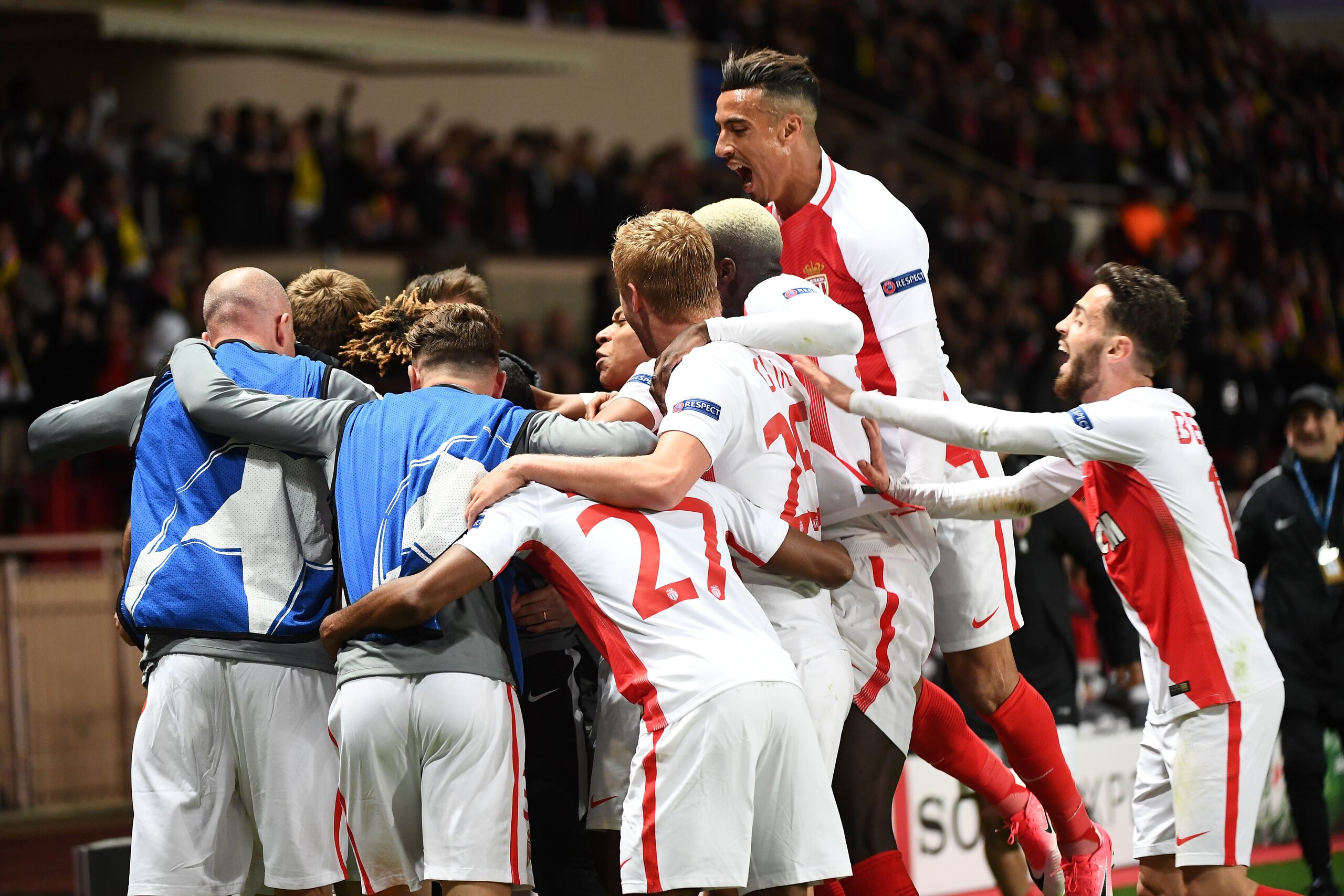 Monaco's Moroccan midfielder Nabil Dirar (Top) and Monaco's Portuguese midfielder Bernardo Silva (R) celebrate after Monaco scored its third goal during the UEFA Champions League 2nd leg quarter-final football match AS Monaco v BVB Borussia Dortmund on April 19, 2017 at the Louis II stadium in Monaco.  / AFP PHOTO / BORIS HORVAT        (Photo credit should read BORIS HORVAT/AFP/Getty Images)