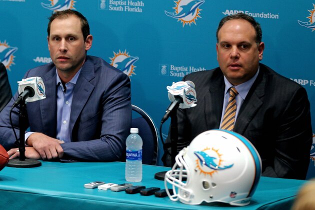 DAVIE, FL - APRIL 29:  Head coach Adam Gase and Executive Vice President, Football Operations	Mike Tannenbaum of the Miami Dolphins talks to members of the press concerning first round draft pick Laremy Tunsil at their training faciility on April 29, 2016 in Davie, Florida.  (Photo by Mike Ehrmann/Getty Images)